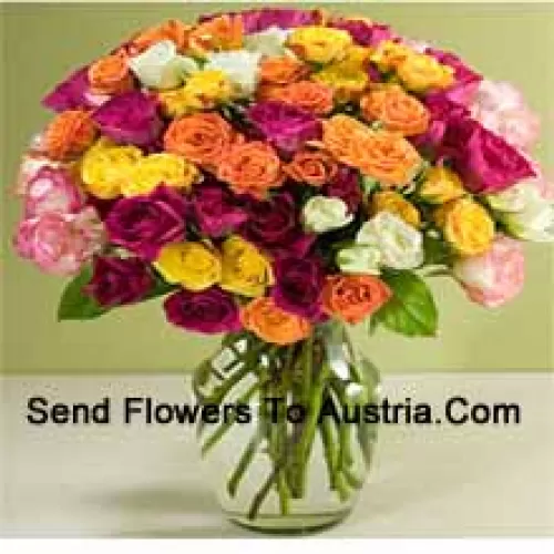 75 Mixed Colored Roses With Some Ferns In A Glass Vase