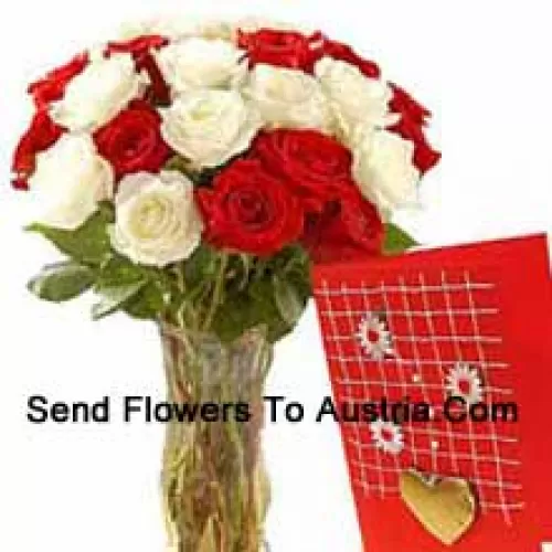 15 Red And 10 White Roses In A Glass Vase Accompanied With A Free Greeting Card