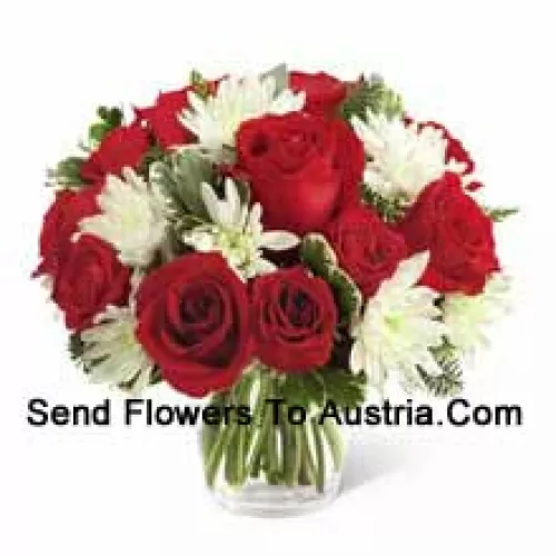 This Bouquet?is a charming display of holiday beauty and winter warmth. Rich red roses and spray roses pop against white chrysanthemums, assorted Christmas greens and eucalyptus, arranged in a round clear glass vase to create a gift that will spread the goodwill of the season to your special recipient. (Please Note That We Reserve The Right To Substitute Any Product With A Suitable Product Of Equal Value In Case Of Non-Availability Of A Certain Product)